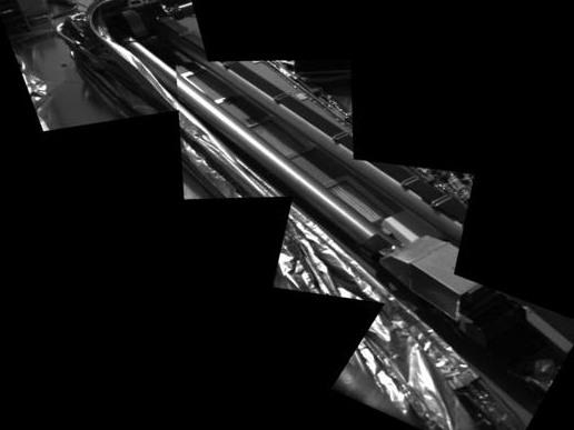 En mosaikbild �ver robotarmen.