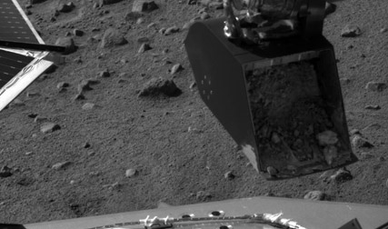 Gr�vskopan i arbete.